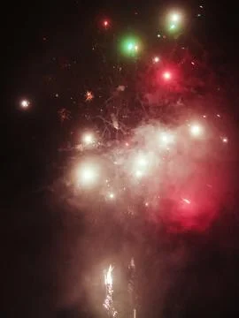 Fireworks with a red background in the sky. Stock Photos