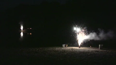 Fireworks with a reflection in the distance Stock Footage 474624