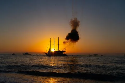 Fireworks on the ship at sunset Stock Photos