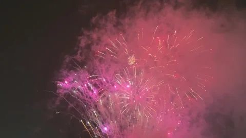 Fireworks show on cloudy snowfall winter background Stock Footage 294175717