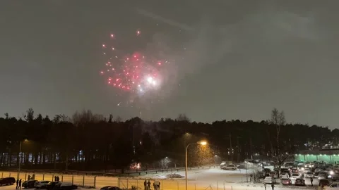 Fireworks show on cloudy snowfall winter background Stock-Footage 294175781