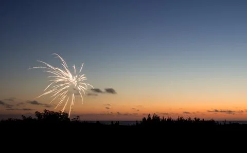 Fireworks at sunset Stock Photos