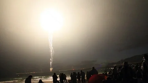 Fireworks take off on beach Stock Footage 80751187
