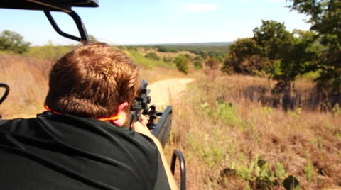 Firing an AR15 off into the distance. Stock Footage 67898208