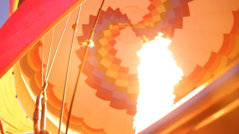 Firing up the balloon right before take off in the sky riding high Видео 128743241