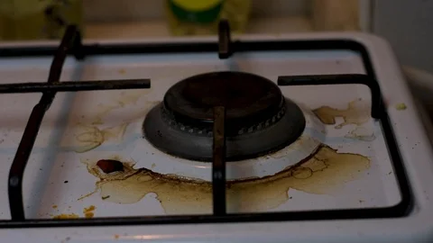 Firing up a Dirty Stove with Match Stock Footage