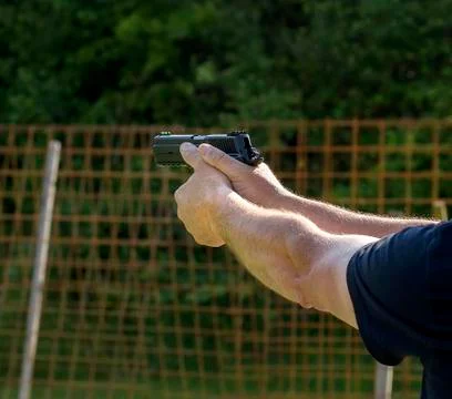 Firing with gun Stock Photos