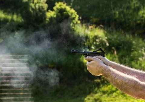Firing with gun Foto stock