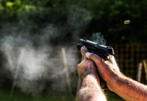 Firing with gun Foto stock