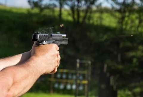 Firing with gun Foto stock