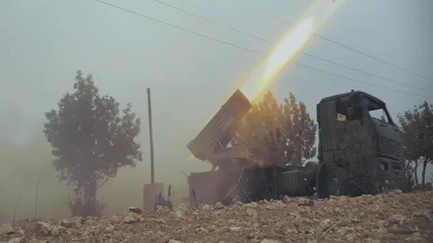 Firing multiple rocket launchers Aleppo, Syria Video stock 169241225
