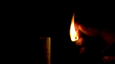 Firing the wax candle with match Stock Footage 149963196