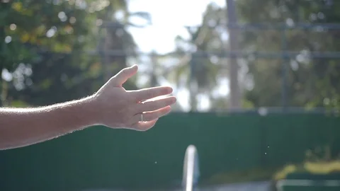 A firm handshake with sweat spray after a game of tennis, with the movement of Stock Footage 91554053