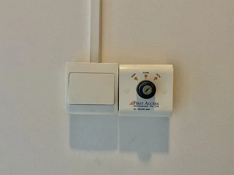 First access tombol and switch on and off  button on the wall landscape Stock Photos