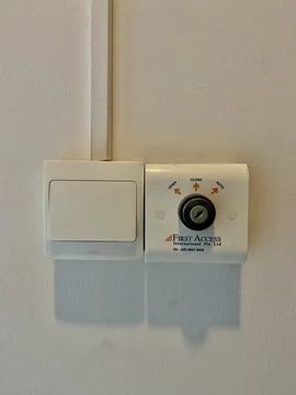 First access tombol and switch on and off  button on the wall Stock Photos
