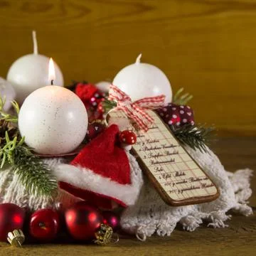 First advent with one burning candle on the wreath. Stock Photos