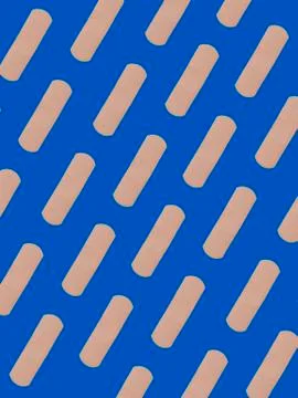 First aid adhesive plasters in diagonal pattern on blue background Foto stock