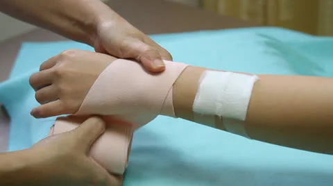 First aid bandaging forearm Stock Footage 26383917