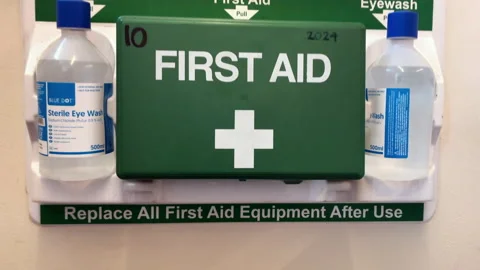 First aid box with eye wash on wall Stock Footage 171238595