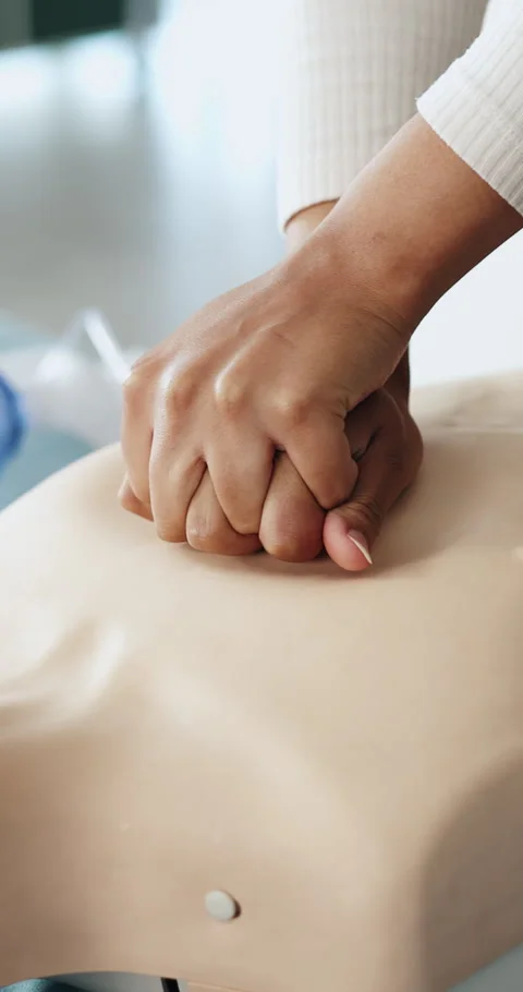 First aid, hands and person with mannequin for cpr training for safety 스톡 동영상 332986598