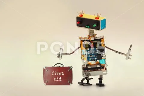 First aid kit and handyman service worker with screwdrivers. Fun toy robot Stock Photos