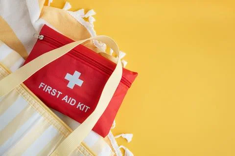 First aid kit in beach bag for summer travel Stock Photos