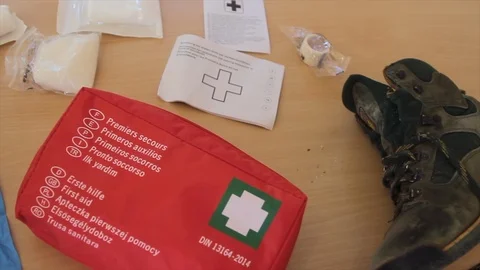 First aid kit complete with a boot that could indicate a mountain accident a Stock Footage 118742681