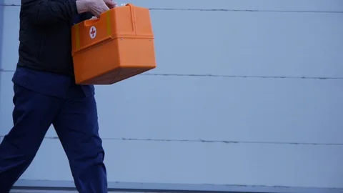 First aid kit in hand Ambulance doctor. Stock Footage 129664089