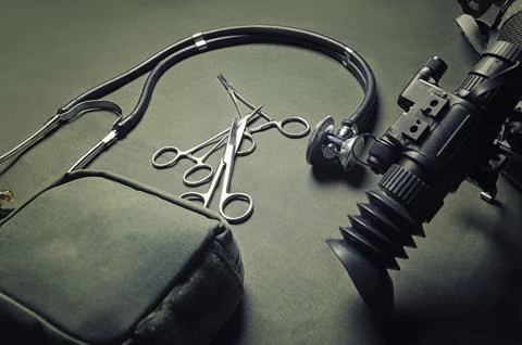 First aid kit, a phonendoscope and a set of scissors, together with a night.. Stock Photos