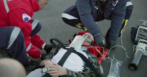 First aid, paramedic and emergency with saving and medical support, accident and Stock Footage 252736732