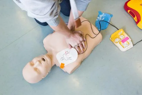 First aid resuscitation course using AED. Stock Photos