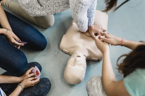 First aid resuscitation course using AED. Stock Photos