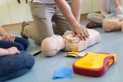 First aid resuscitation course using AED. First aid cardiopulmonary resusc... Stock Photos