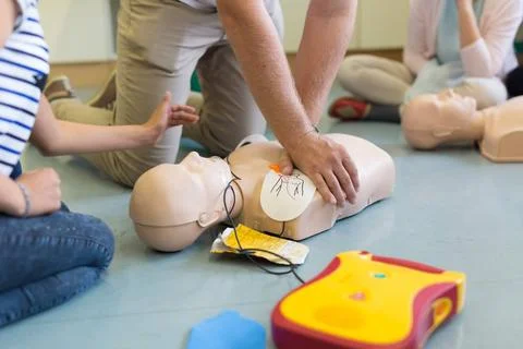 First aid resuscitation course using AED. First aid cardiopulmonary resusc... Stock Photos