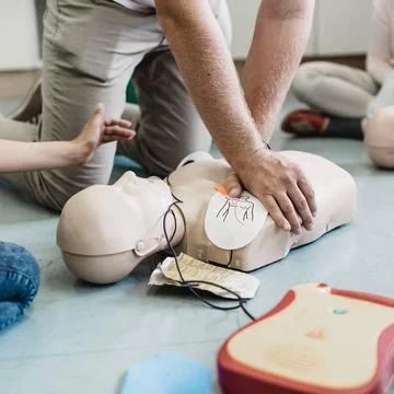 First aid resuscitation course using AED. First aid cardiopulmonary resusc... Stock Photos