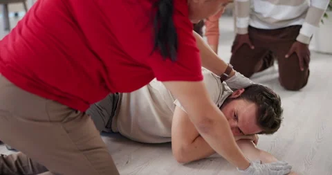 First aid, training and man with people in workshop for learning, healthcare and Stock Footage 297170584