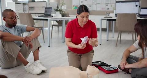 First aid, training and mannequin with people in workshop for learning Stock Footage 297189748