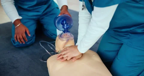 First aid, training and nurse with AED cpr on dummy for cardiac arrest Video stock 300747853