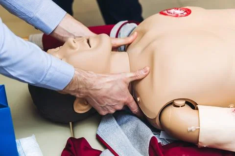 First aid training course with dummy, CPR emergency reanimation procedure o.. Stock Photos