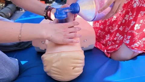 First aid training with CPR mannequin. Medical students practicing cardiopulmon Stock-Footage 339766071
