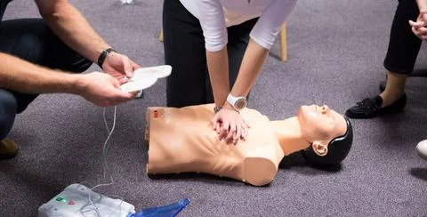 First Aid Training. Defibrillator CPR Practice CPR training medical proced... Stockfoto's