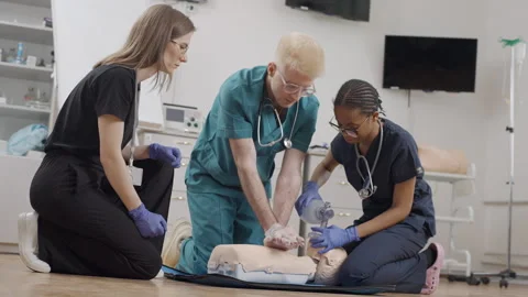 First aid training on a medical dummy with instructor Stock-Footage 278461014