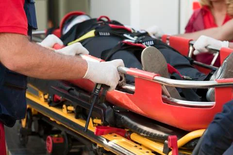 First aid training, Paramedics rushing patient into an ambulance Stock Photos
