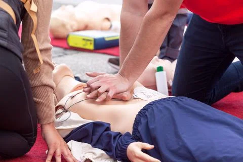 First aid training using automated external defibrillator device - AED Stock Photos