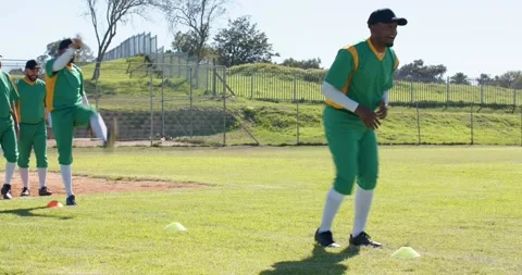 First athlete moving forward male baseball team doing cone drill on field, Stock Footage 339650835