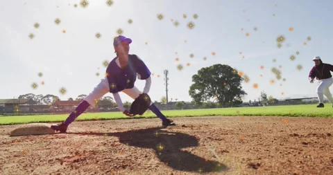 First baseman catching incoming throw with sparkles and tagging runner out for Stock Footage 318758331