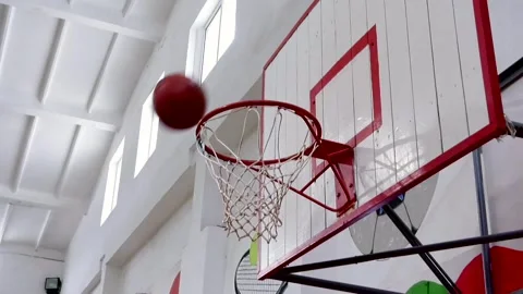 The first basketball misses the hoop, the second one hits the hoop. Stock Footage 337426634