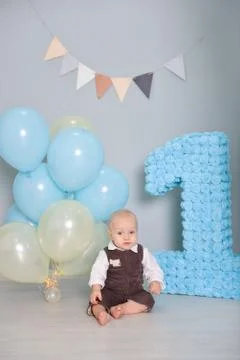 First birthday. smash the cake, a thematic birthday - a travel, trip. globe. Stock Photos