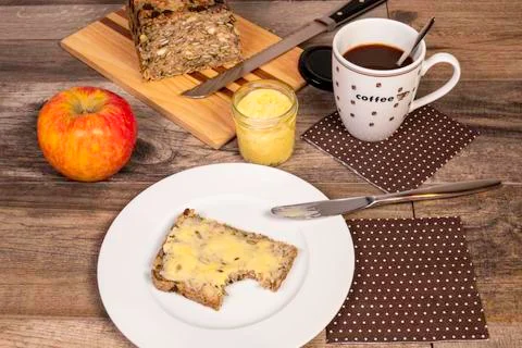 First Bite From Whole-Grain Bread With Saffron Butter Stock Photos