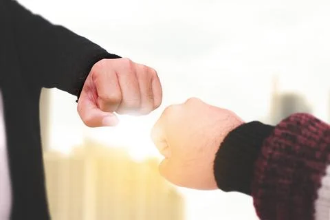 First bump of two individuals , a form of greeting or celebration Stock Photos